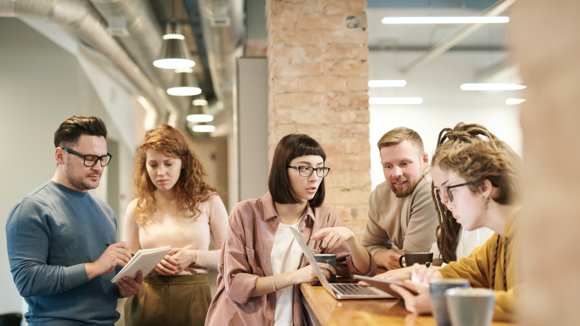 A group of people discussing information material